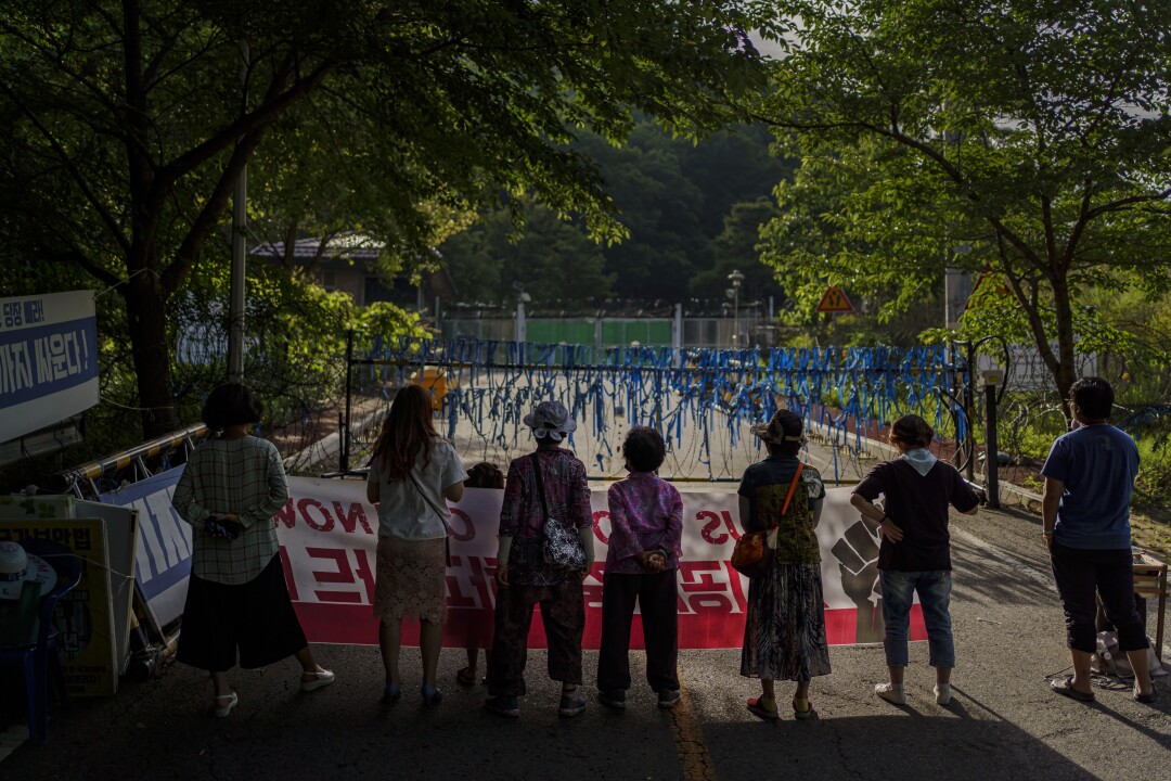 Local residents hold their daily protest outside the gates into the Terminal High Altitude Area Defense (THAAD) base in June.
