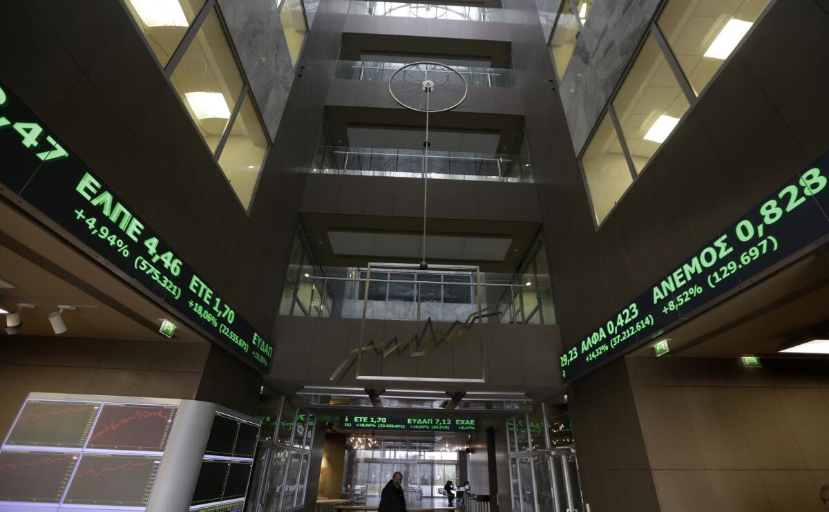 European stock markets rose on the news that Greece's creditors had been satisfied with the government's plan for budgetary reform to extend its bailout. The Athens Stock Exchange, shown here, rose nearly 10% on Tuesday.