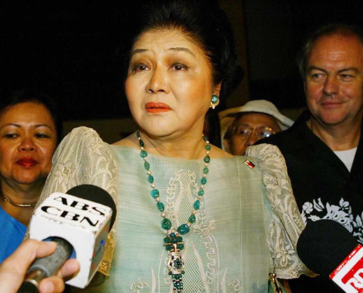 Former Philippine First Lady Imelda Marcos, shown in 2004, has emerged from foreign exile and scandal to resume a position of authority as legislator for the family stronghold of Ilocos Norte. With the widow, son and daughter of late dictator Ferdinand Marcos now politically resurrected, the government seems inclined to scrap the search for billions in state property Marcos was believed to have hidden before fleeing in 1986.