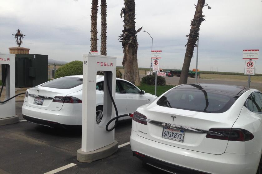 Tesla Model S sedans at the Harris Ranch supercharging station on Interstate 5.