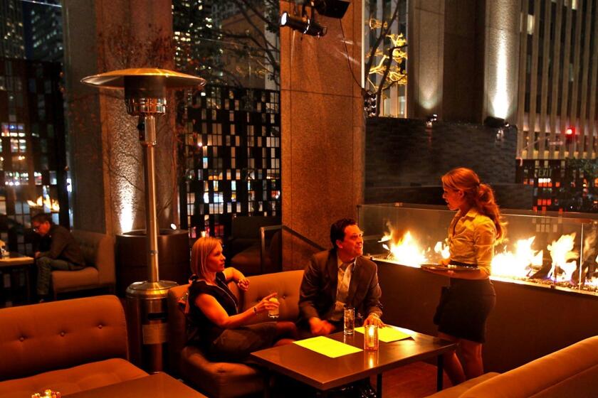 A massive fireplace warms patrons who eat and drink at Le Ka's massive outdoor terrace.