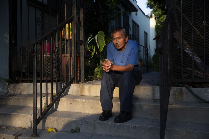 LOS ANGELES , CALIF. - AUGUST 08, 2019: Mario Canel at his home on Thursday, Aug. 8, 2019 in Los Angeles , Calif. He is being evicted after a developer purchased his building, and he doesn't know where he can afford to move because he only takes in a little each month with Social Security. (Liz Moughon / Los Angeles Times)