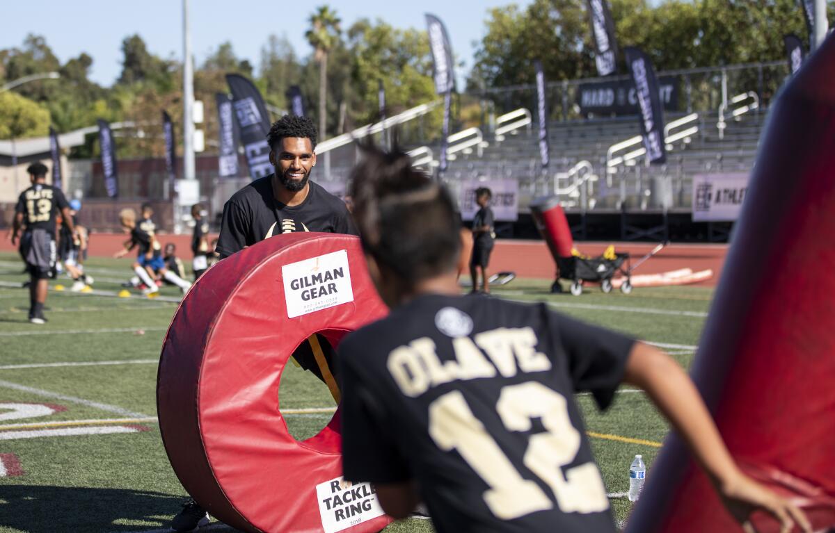 Chris Olave hosts a free youth football camp Thursday at Mission Hills High, his alma mater in San Marcos. 