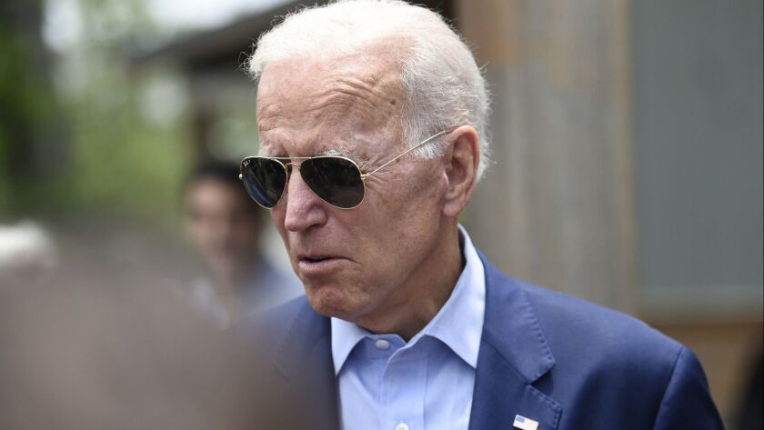 Democratic presidential candidate and former Vice President Joe Biden speaks with reporters outside a restaurant in Charleston, S.C., on Sunday.