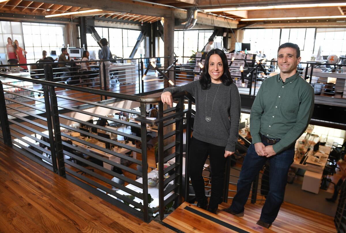 Katie Biber, center, former general counsel for Mitt Romney, and Steven Siger, right, who worked for President Obama, are now attorneys at Thumbtack in San Francisco. (Christina House / For The Times)