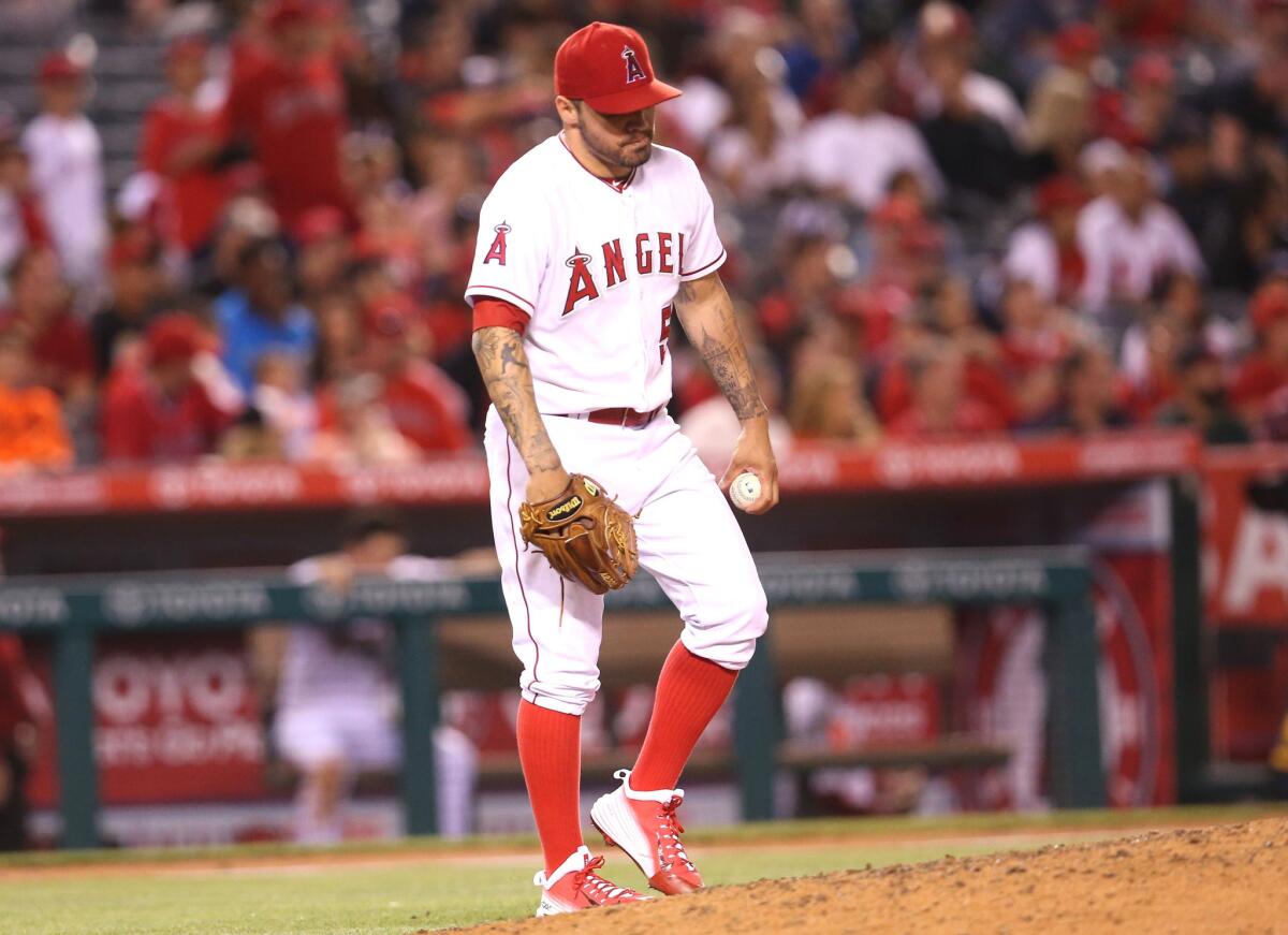 Angels starting pitcher Hector Santiago reacts after giving up a three-run home run in the sixth inning against the Rays.