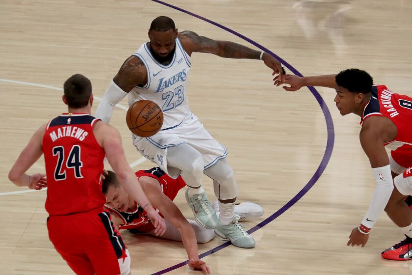LOS ANGELES, CALIF. - FEB. 212, 2021. Lakers forward LeBron James fights for control.
