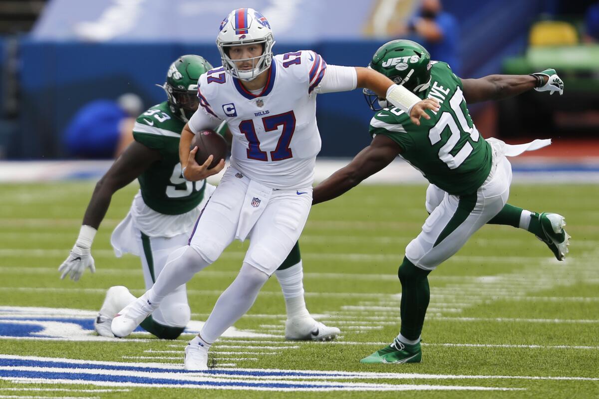 Buffalo Bills quarterback Josh Allen scrambles during the first half against the New York Jets.