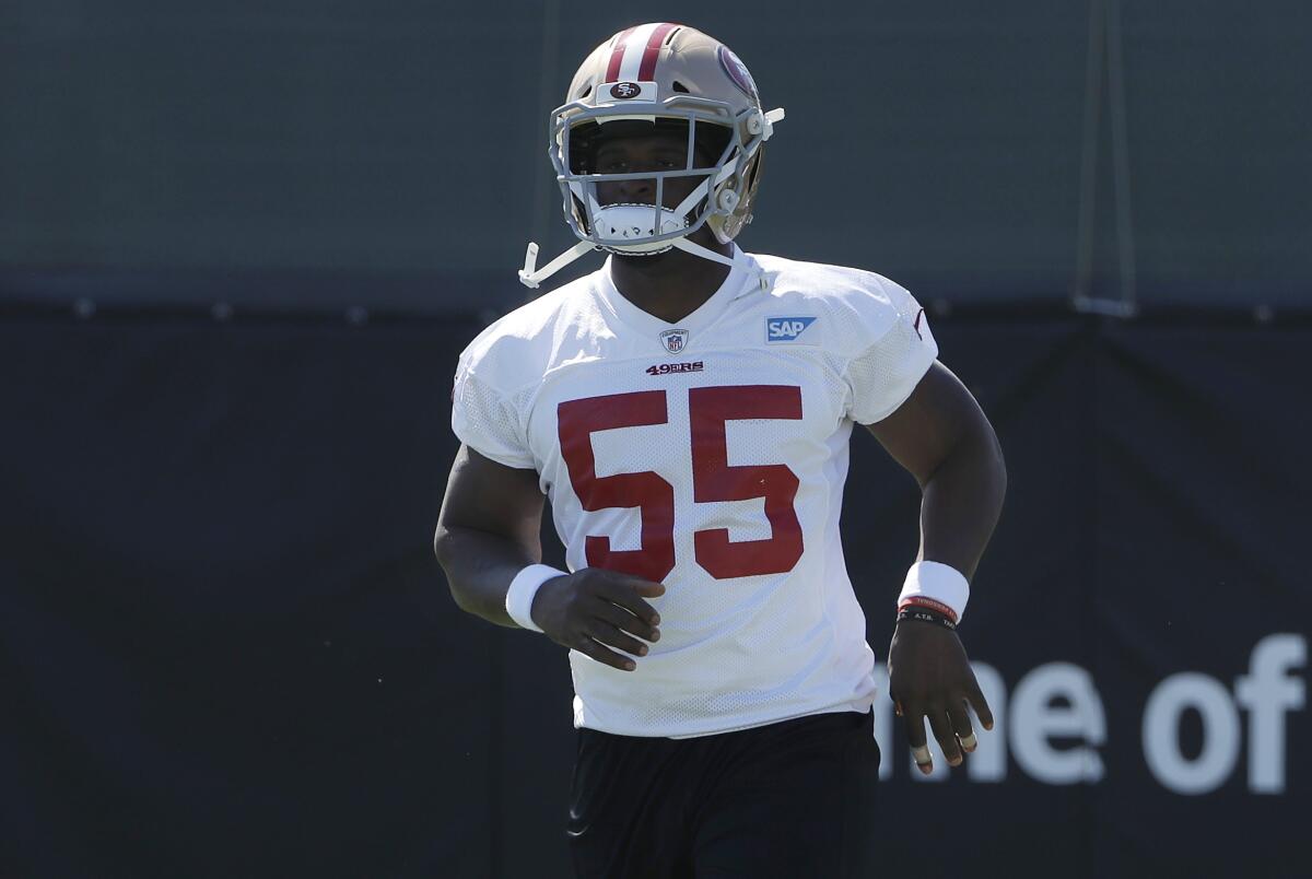 San Francisco 49ers' Dee Ford jogs during a team training camp session on July 27.