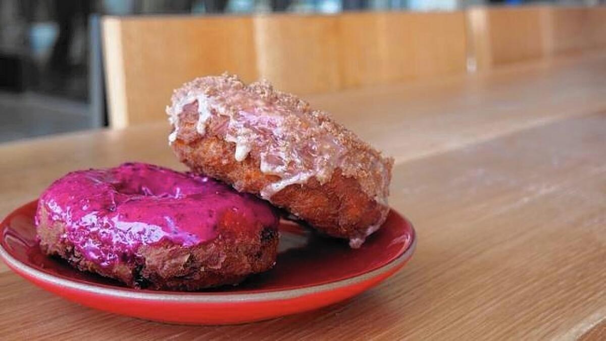 Huckleberry and cinnamon doughnuts are among the offerings from Sidecar Doughnuts, which is opening a location in Santa Monica on Tuesday.