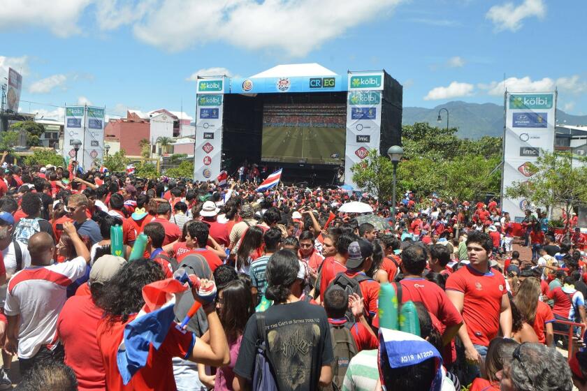 Costa Rican fans gather at Democracy Square in San Jose on Friday to watch their team defeat Italy, 1-0, to reach the knockout round of the World Cup.