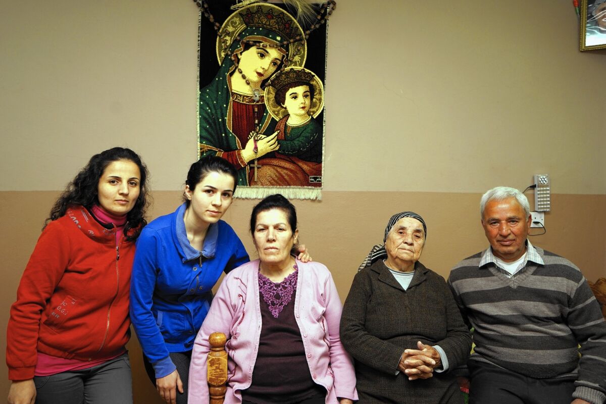 Members of the Jumaa family, from left, in Sheikhan, Iraq: sisters Sanaa and Asmar; their mother, Sittu Adam Qaysar; grandmother Esther Zaya Hormez; and their father, Kenyas.