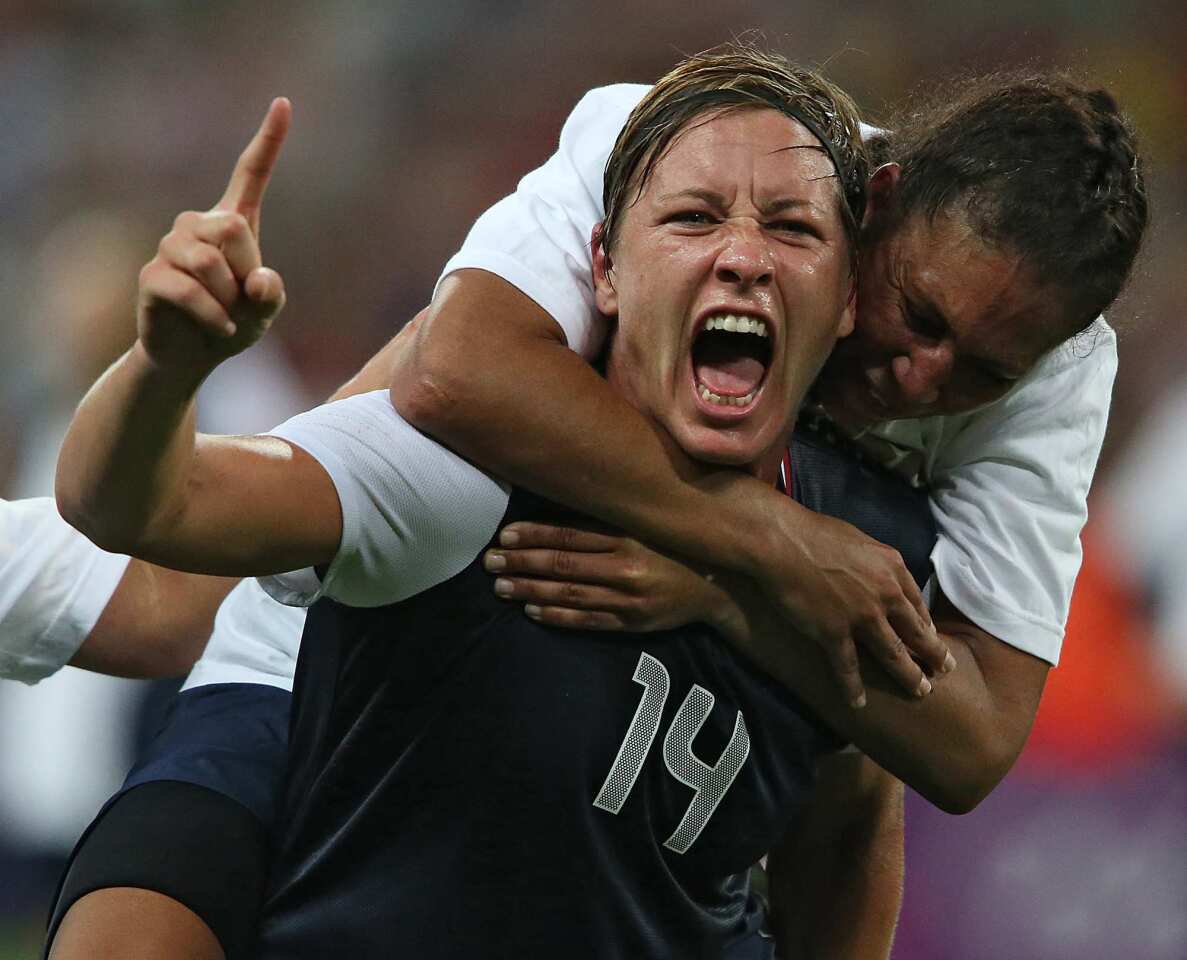 Abby Wambach, left, of the United States celebrates with teammate Shannon Boxx after beating Japan 2-1 in the women's soccer final Thursday.