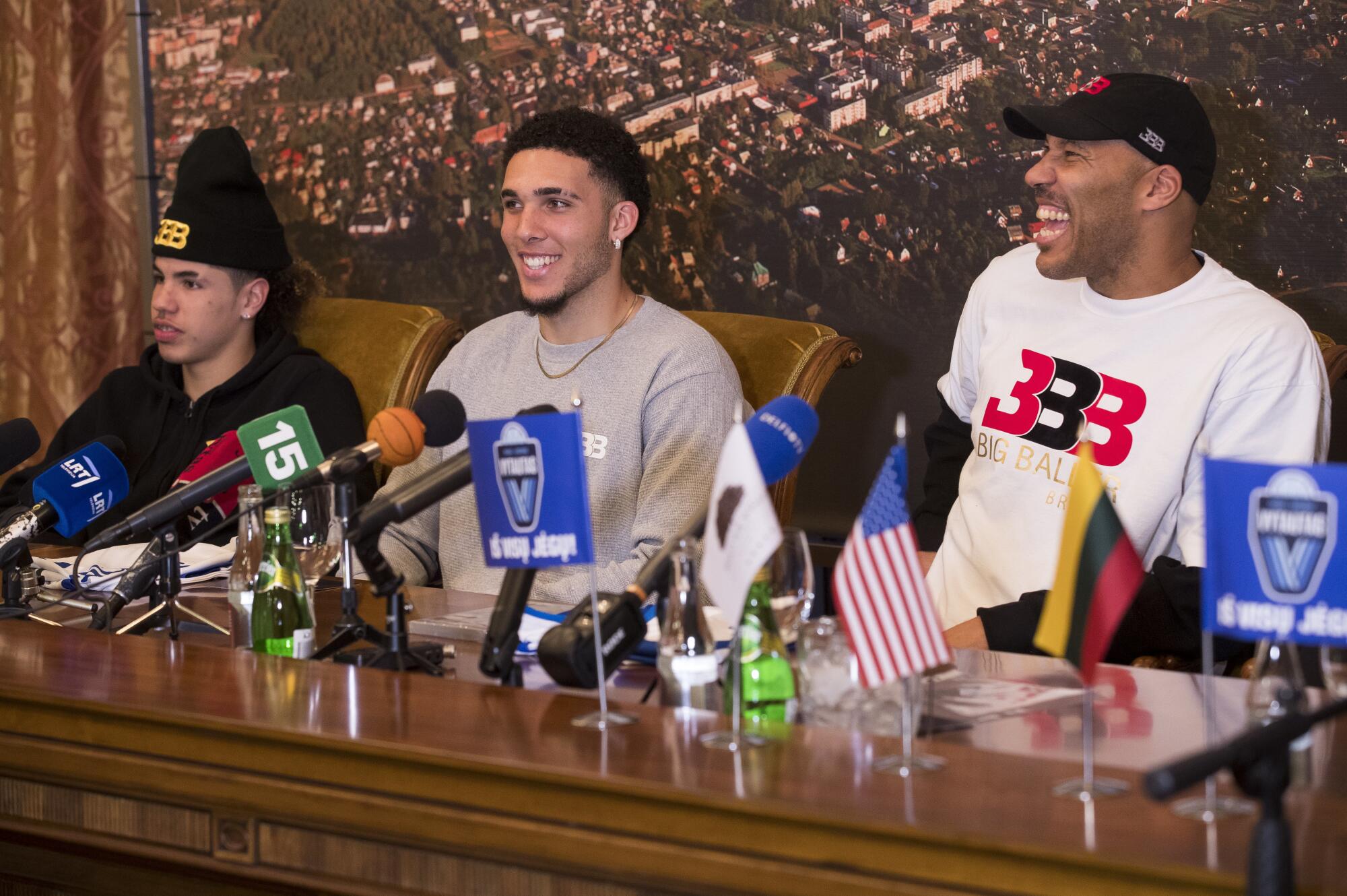 LaVar Ball joins sons LiAngelo Ball (center) and LaMelo Ball during a news conference with a club team in Lithuania.