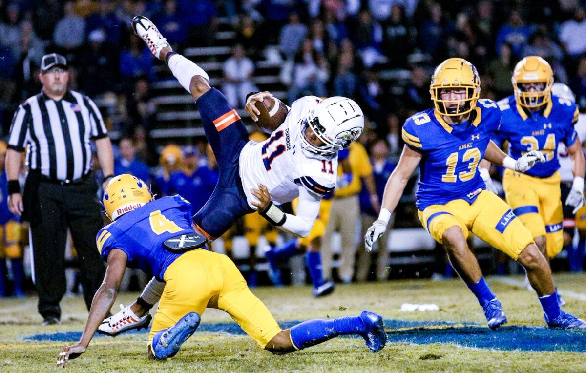 The Bishop Amat player upending Chaminade QB Seth Shigg is defensive back Foster Slaughter.