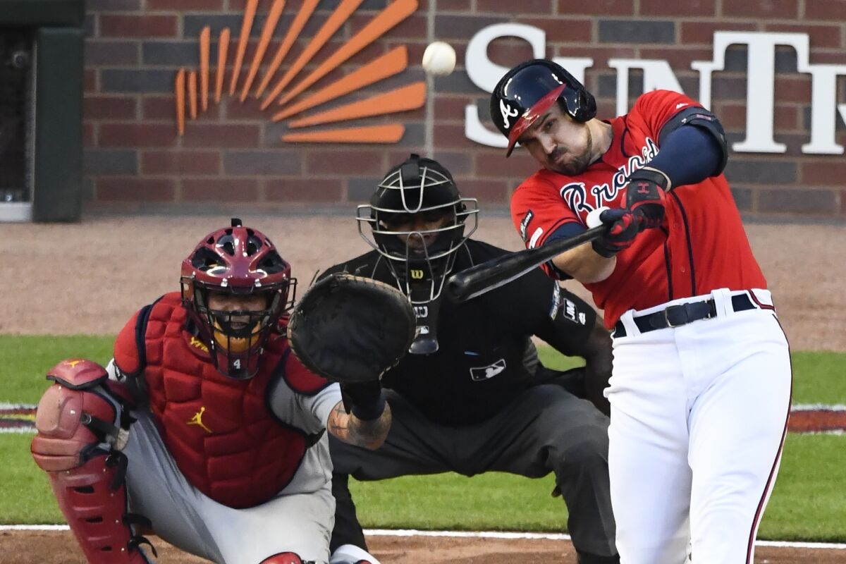 The Braves' Adam Duvall hits a two-run, pinch-hit homer in his team's 3-0 win over the Cardinals on Oct. 4, 2019.