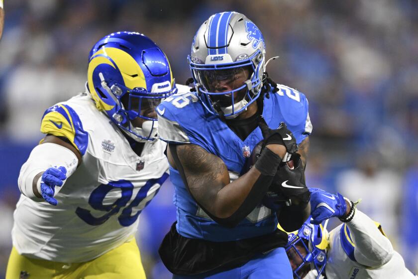 Detroit Lions running back Jahmyr Gibbs (26) runs the ball as Los Angeles Rams.