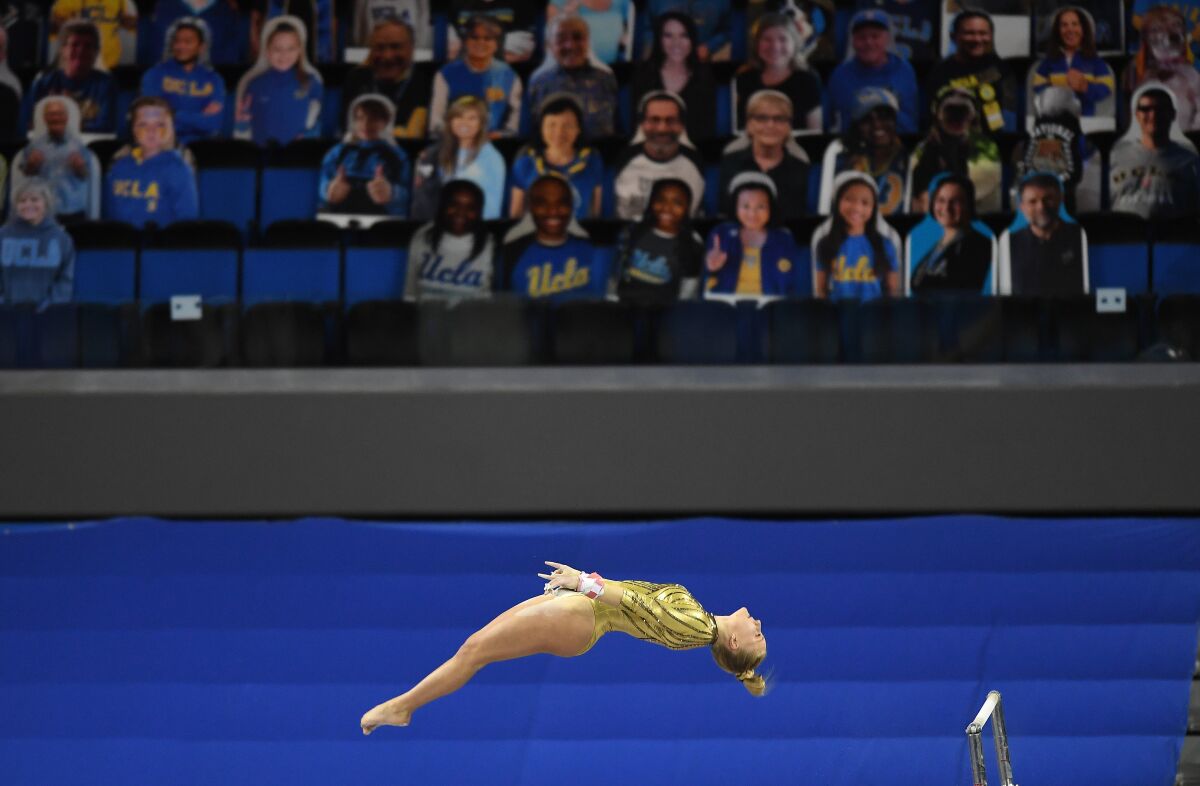 UCLA's Savannah Kooyman dismounts from the uneven bars during competition against BYU at Pauley Pavillion Wednesday.