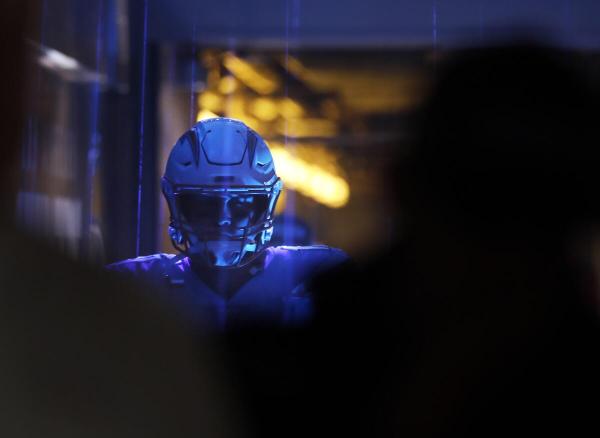 Chargers quarterback Philip Rivers walks to the field before Sunday's loss to the Oakland Raiders.