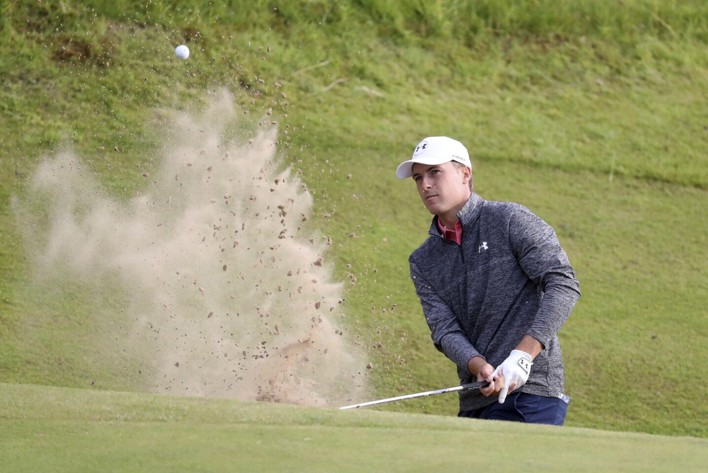 Jordan Spieth plays out of a bunker on the 17th hole during the third round of the British Open Golf Championship, at Royal Birkdale.