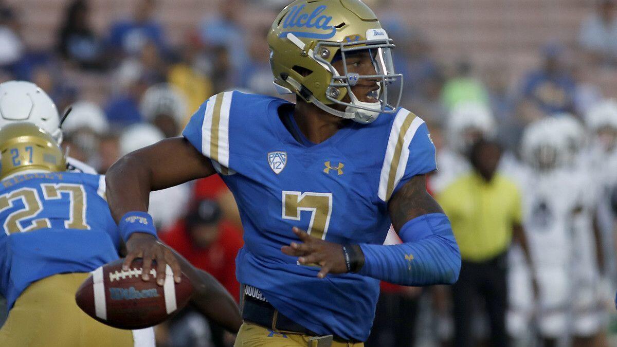 UCLA quarterback Dorian Thompson-Robinson scrambles out of the pocket against Cincinnati in the fourth quarter at the Rose Bowl on Sept. 1.