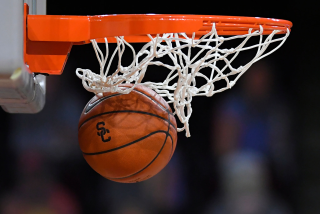 LOS ANGELES, CA - FEBRUARY 22: SC logo and Nike logo visible on the ball going through the hoop.