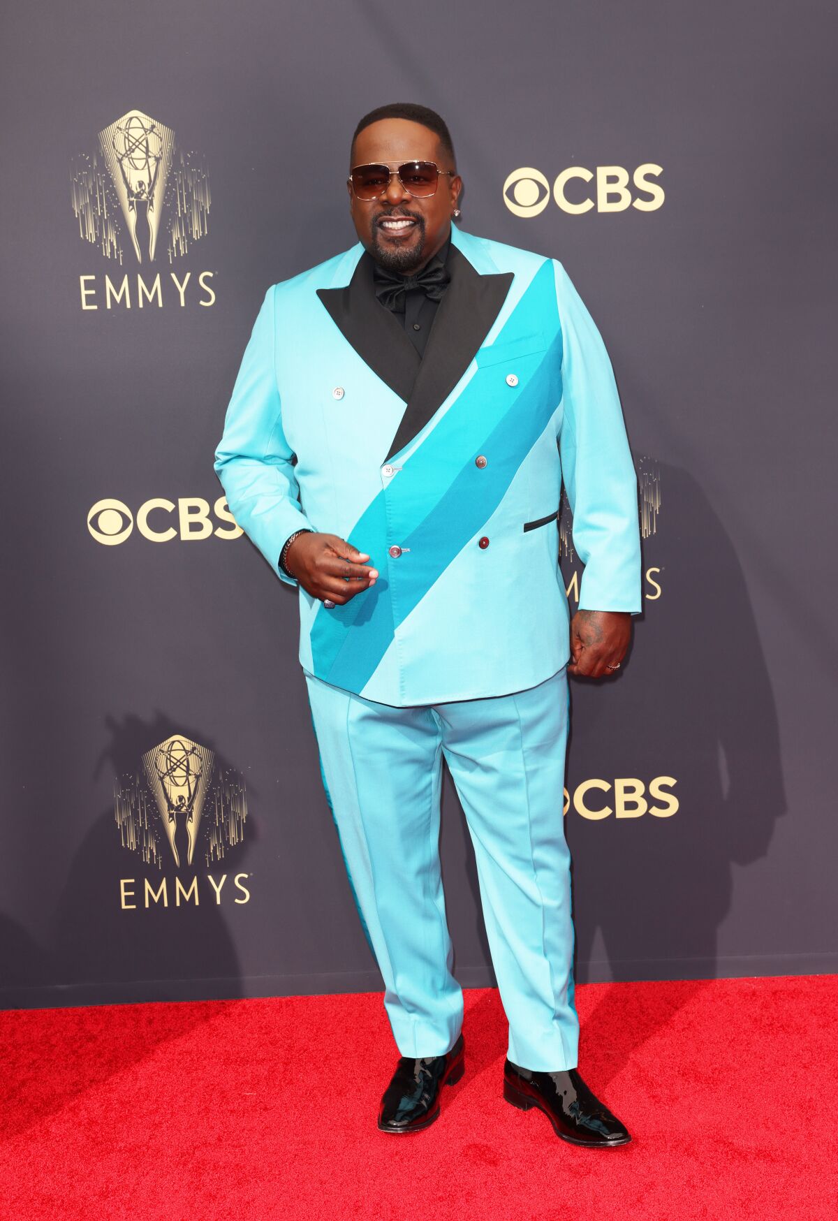 A man on the red carpet in a light-blue suit