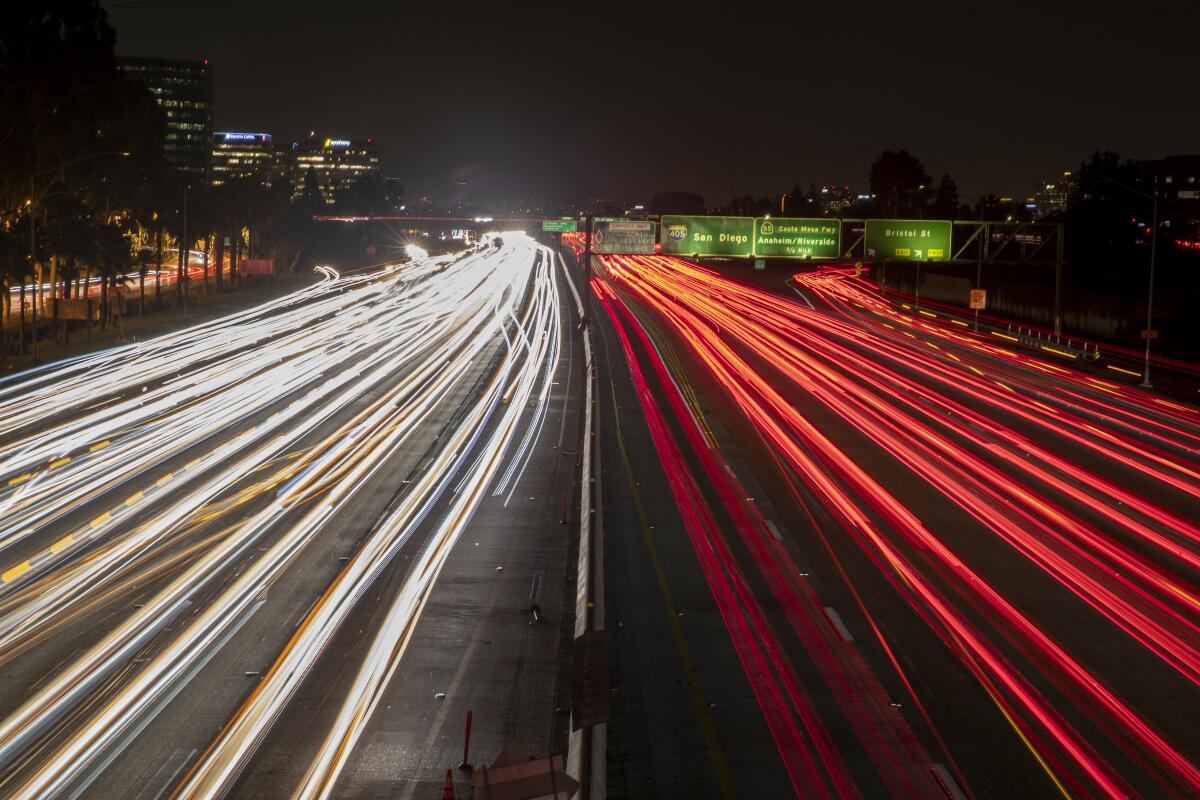 A long exposure of cars traveling on 405 freeway at dusk in Costa Mesa in 2019. 