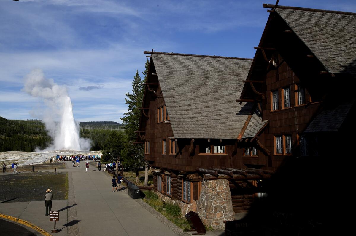 The Old Faithful Inn, built from local logs and stone in 1904, is still the largest log structure in the world. It has 327 rooms and treats visitors to a perfect view of the famous Old Faithful geyser, adjacent to the hotel.