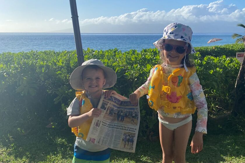 Cullen and Riley Bible from Poway on vacation in Ka'anapali, Maui with their News Chieftain.