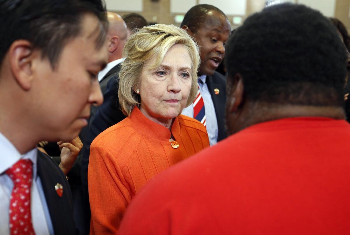 In this Aug. 18, 2015, photo, Democratic presidential candidate Hillary Rodham Clinton speaks with people at a town hall meeting in North Las Vegas, Nev. Clinton's campaign is facing fresh worries among congressional Democrats about her use of a private email account while serving as secretary of state. Poll results suggest the inquiry may be taking a toll on her presidential campaign.