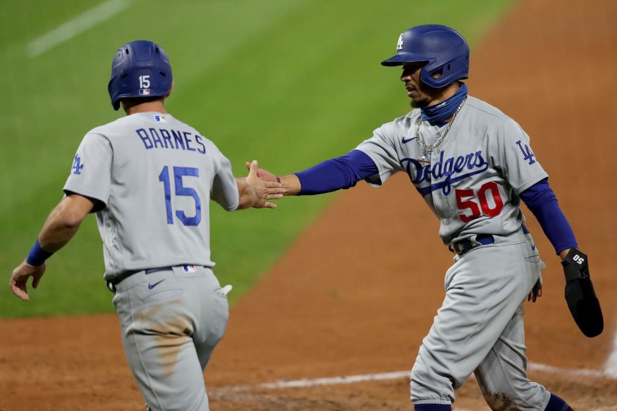 Dodgers catcher Austin Barnes, left, and right fielder Mookie Betts celebrate.