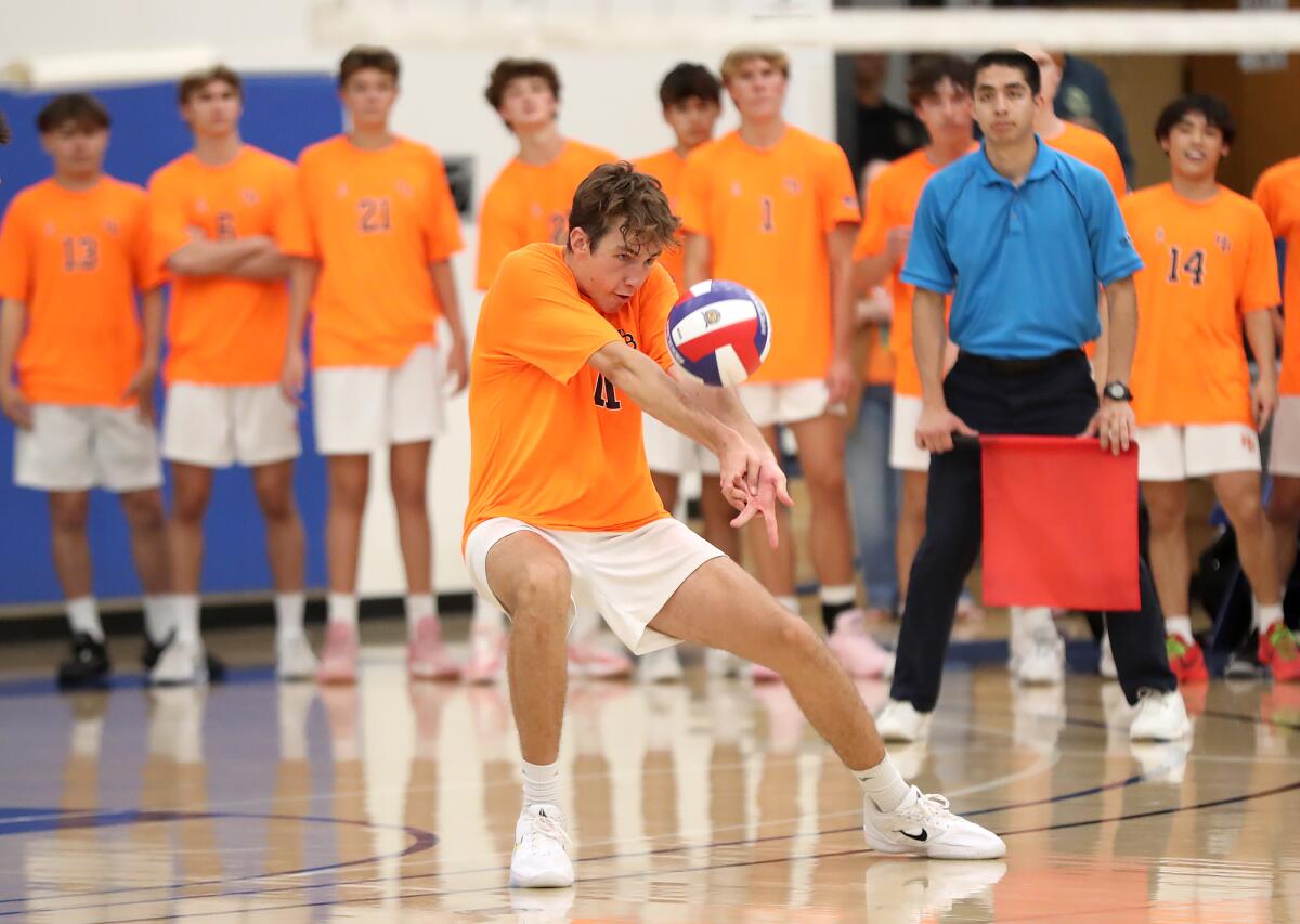 Huntington Beach's Logan Hutnick (11) digs a ball against Mira Costa in the CIF Division 1 boys' volleyball final.