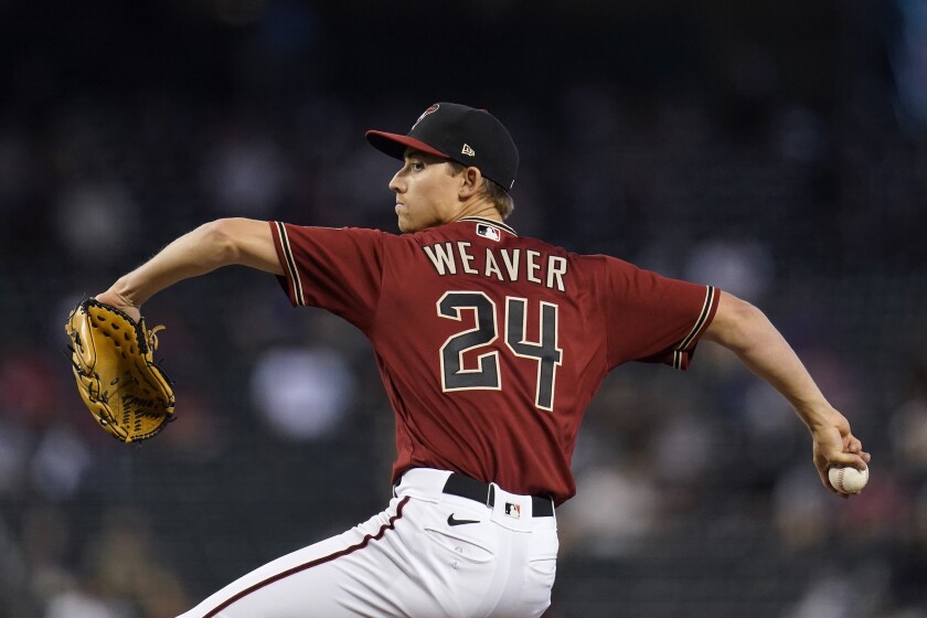 Arizona Diamondbacks starting pitcher Luke Weaver throws a pitch against the Cincinnati Reds during the first inning of a baseball game Sunday, April 11, 2021, in Phoenix. (AP Photo/Ross D. Franklin)