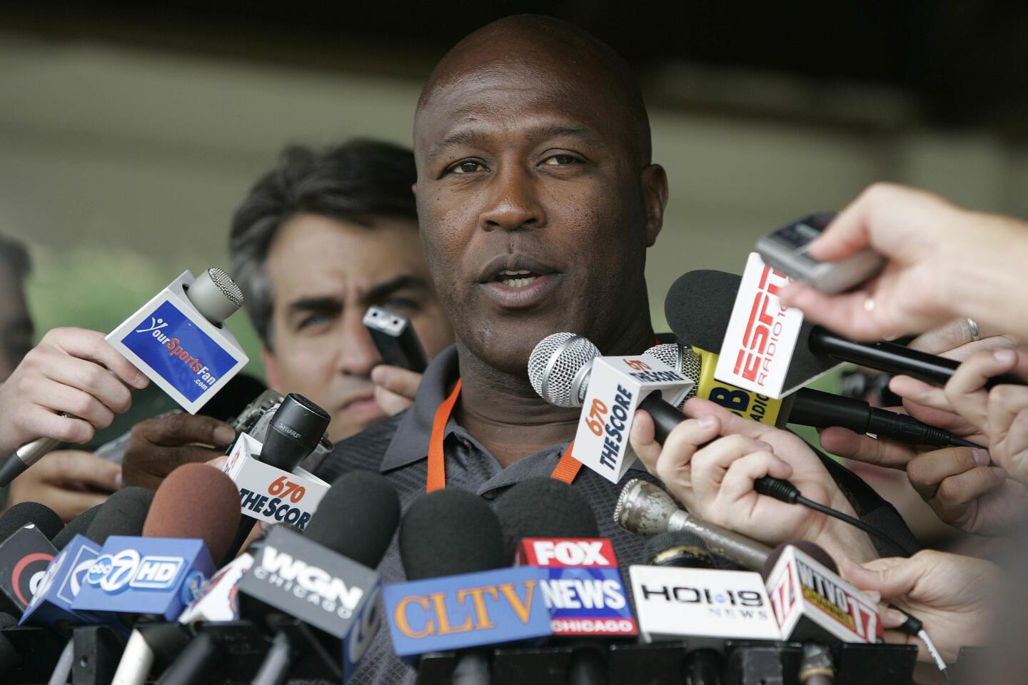Lovie Smith talks to the media as the Bears arrive for training camp on July 26, 2007.