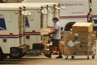 VAN NUYS, CA - SEPTEMBER 09: Mail carriers load their trucks at the United States Postal Service (USPS) located at 15701 Sherman Way in Van Nuys, California on the morning of September 9, 2020. The USPS may be experiencing delays. U.S. Postal Service on Wednesday, Sept. 9, 2020 in Van Nuys, CA. (Al Seib / Los Angeles Times