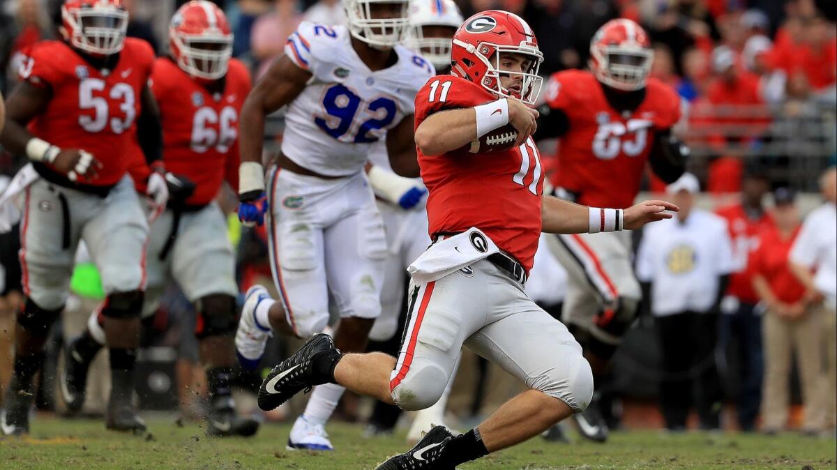 Georgia quarterback Jake Fromm rushes during the game against Florida on Oct. 27, 2018 in Jacksonville, Fla.