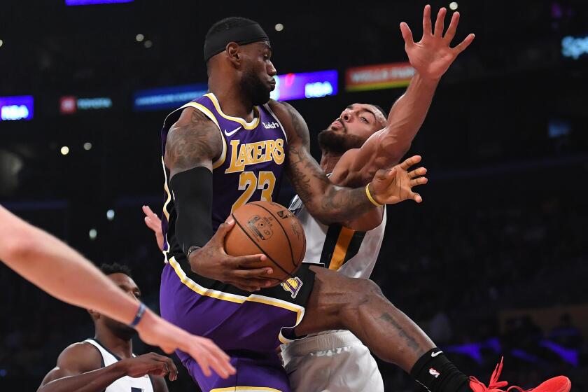 LOS ANGELES, CALIFORNIA - OCTOBER 25: LeBron James #23 of the Los Angeles Lakers makes a pass around Rudy Gobert #27 of the Utah Jazz during the first half at Staples Center on October 25, 2019 in Los Angeles, California. (Photo by Harry How/Getty Images)