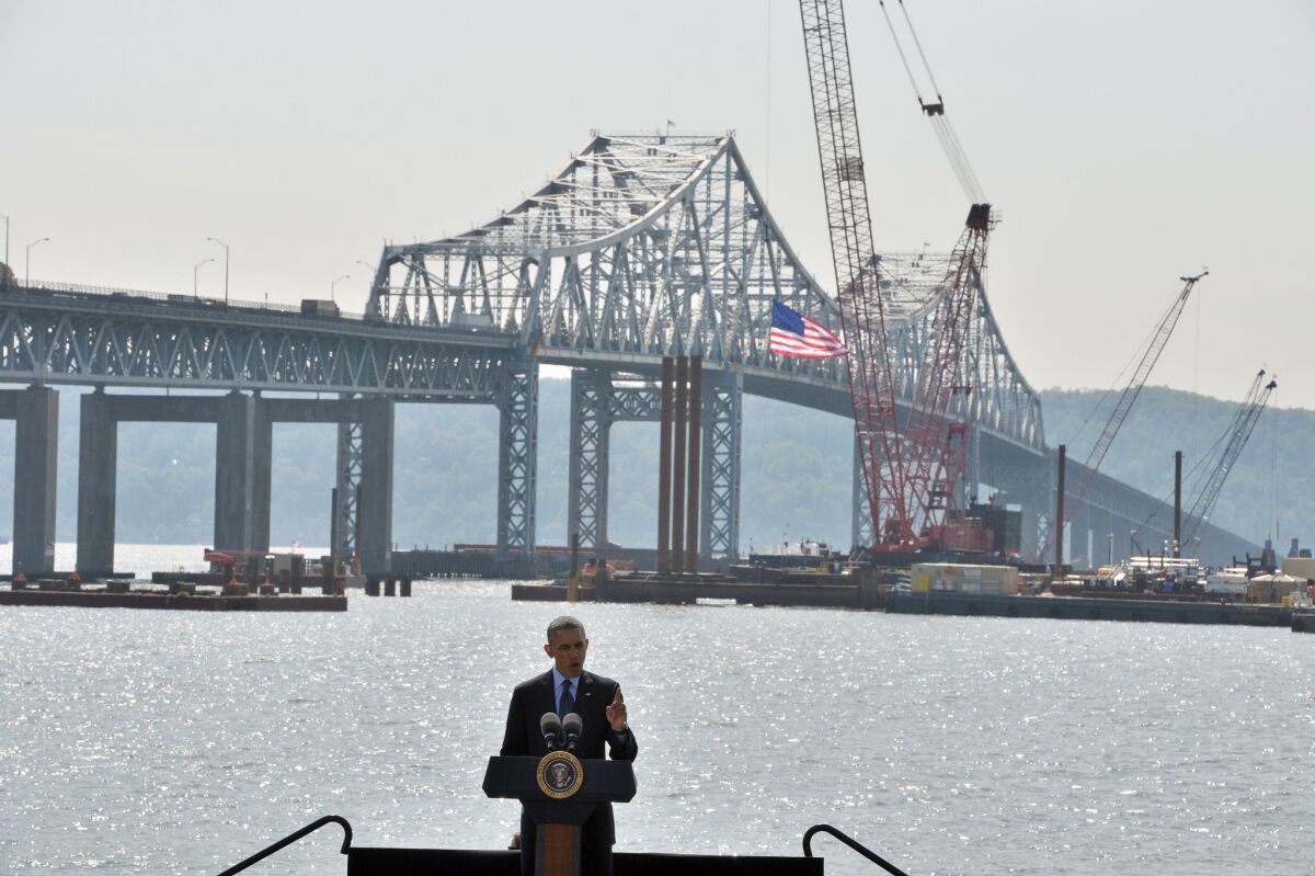 Standing on a stage with the Tappan Zee Bridge in the background, President Obama speaks in Tarrytown, N.Y., on the need for "21st century transportation infrastructure."