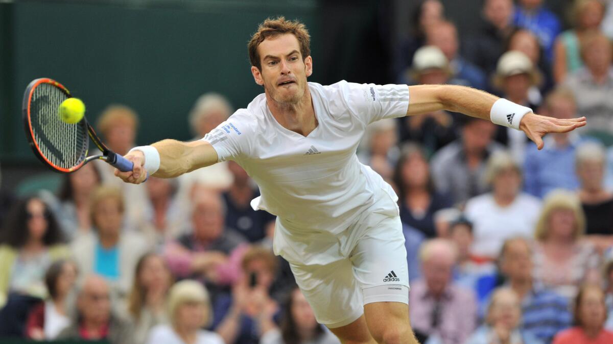 Andy Murray plays a return during his fourth-round win over Kevin Anderson at Wimbledon on Monday.