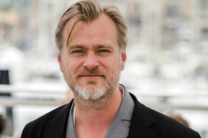 FILE - In this May 12, 2018, file photo, director Christopher Nolan poses during a photo call at the 71st international film festival in Cannes, southern France. Warner Bros. announced late Thursday, June 25, that it is delaying the release of Nolan’s sci-fi thriller “Tenet” from July 31 until Aug. 12, a date the studio says will give it more flexibility to get the film in theaters despite uncertainty caused by a surge in coronavirus cases in certain locales. (Photo by Arthur Mola/Invision/AP, File)