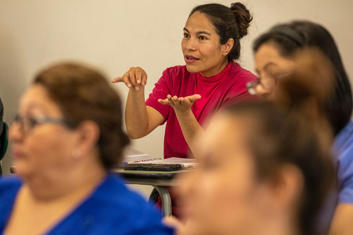 A woman speaks during a class discussion.