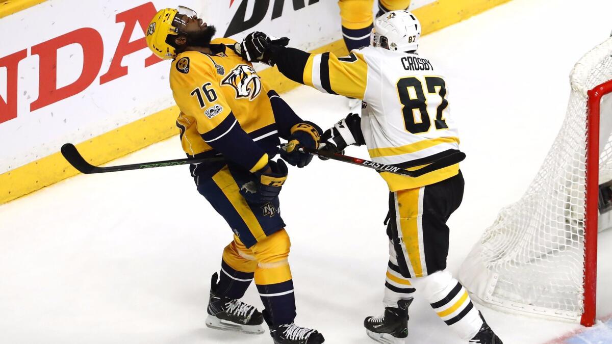 Pittsburghy's Sidney Crosby punches Nashville's P.K. Subban in a June 5 game.