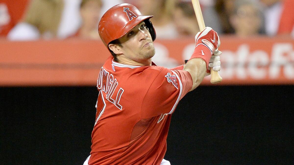 Angels outfielder Collin Cowgill hits a run-scoring, ground-rule double in the sixth inning of the Angels' 7-2 win over the Philadelphia Phillies on Tuesday.