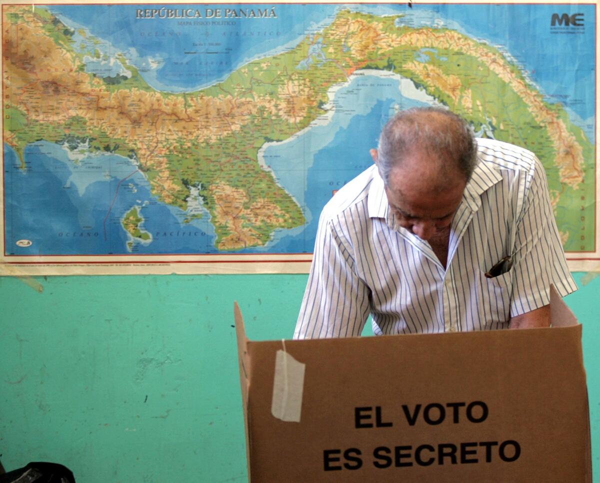 A Panamanian citizen casts his vote during the referendum for the widening of the Panama Canal on October 22, 2006, in Panama City. (Orlando Sierra / AFP/Getty Images)