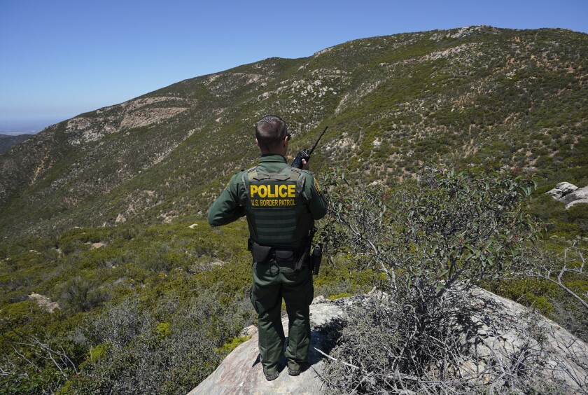 A Border Patrol agent observes an area of the Otay Mountain Wilderness.