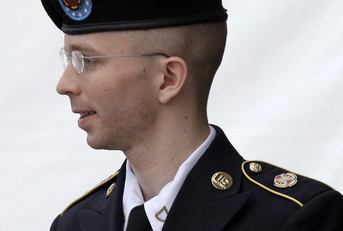 Army Pfc. Bradley Manning is escorted out of a courthouse in Fort Meade, Md.