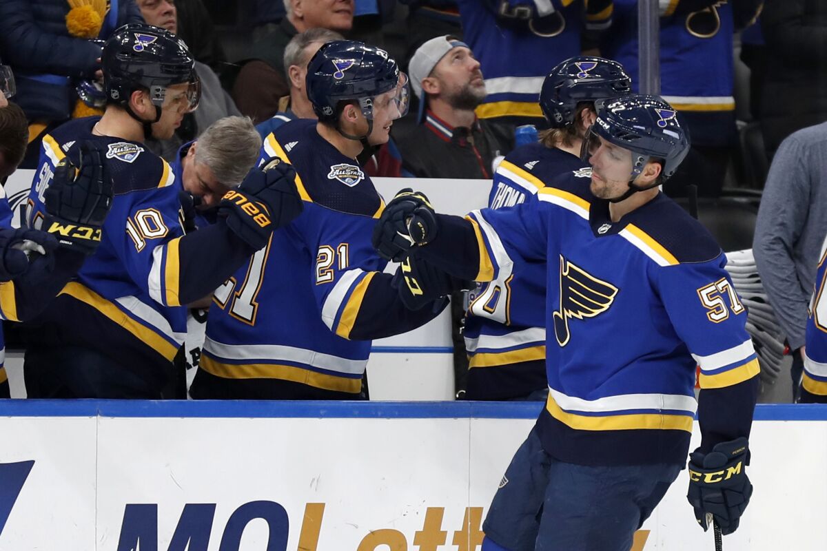 St. Louis Blues forward David Perron is congratulated by Tyler Bozak (21) and Brayden Schenn after scoring  against the Colorado Avalanche on Dec. 16.