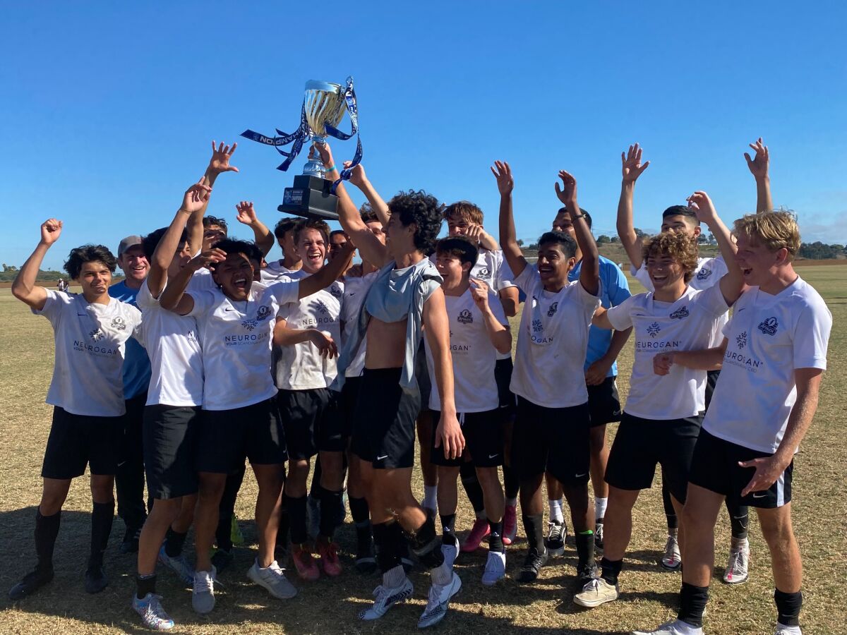 The RSF Attack Boys 2002 Academy soccer team celebrate their victory.