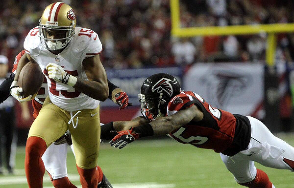 49ers receiver Michael Crabtree gains yardage after making a reception against the Atlanta Falcons in the second half of the NFC championship game on Sunday.